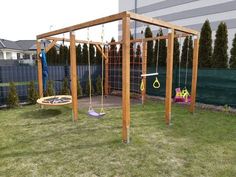 an outdoor play area with swings and toys