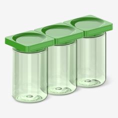 three plastic containers with lids are lined up in the same row on a white background