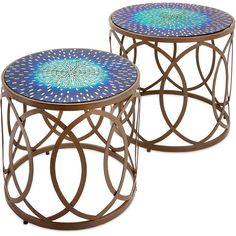 two tables with circular designs on them sitting side by side, one has a blue and white design on the top