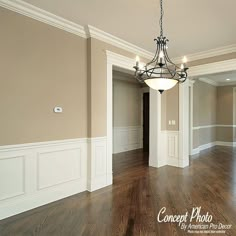 an empty room with hard wood flooring and white trim on the walls is shown