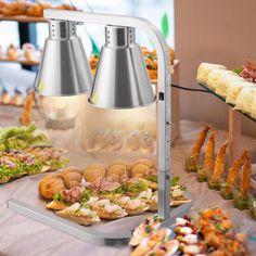 an assortment of appetizers and snacks on a buffet table at a wedding reception