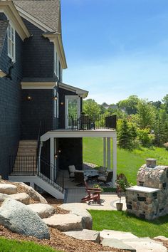 a house with a patio and stone steps leading up to it