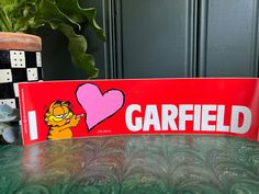 a red sign with the word garfield on it