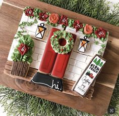 a cake made to look like a christmas scene with wreaths and fire extinguishers