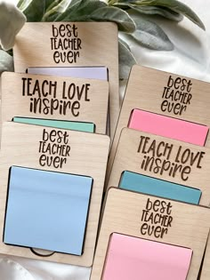 four wooden magnets with different types of writing on them and the words teach love inspire, best teacher ever