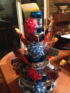 a cake that is sitting on top of a table with candy and candies in it