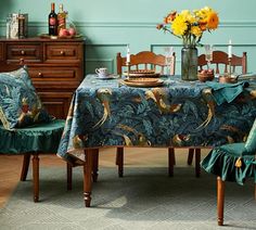 a dining room with blue walls and green chairs