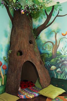 a bedroom with a tree trunk bed in the corner and lots of pillows on the floor