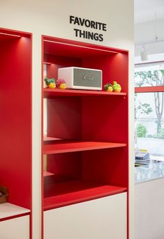 a red and white bookcase with the words favorite things on it's side