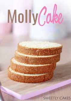 four slices of cake sitting on top of a cutting board with the words moly cake above it