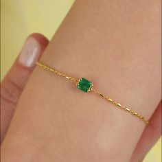 Minimalist Silver Emerald CZ Bracelet is handcrafted by the finest artists with love and care. The combination of Gold Plated delicate chain and square cut emerald CZ Stone meets with 925 Solid Sterling Silver. Dainty May Birthstone Bracelet is made from 18K Gold plated 925 solid sterling silver, emerald cubic zirconia stones. Cute Emerald Bracelet is a perfect match for your outfit and available for everyday using. Dainty Birthstone Bracelet is always awesome gift idea to yourself and your loved ones.   18K Gold Plated Silver Chain Birthstone jewelry is definetely what you're looking for! * Material: High Quality Solid 925 Sterling Silver * Finish: Sterling Silver ∙ 18K Gold * Bracelet Length: 16.5 cm * Chain: Adjustable 3.5 cm Extension  * Gemstone: High Quality Emerald Green - Acquamari Stone Charm Bracelet, Emerald Bracelets, Emerald Bracelet Simple, Green Bracelet, Slytherin Accessories, Open Bangle Bracelet, Square Jewelry, Malachite Bracelet, 18k Gold Bracelet