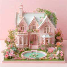 a pink doll house with lots of flowers around it