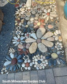 a garden path made out of rocks and gravel