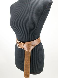 Long women's belt with buckle is made of cow leather of brown color. The wrong part of the belt is made of soft sheep leather of a bright contrasting color. The total length of the belt is 131 cm (51,5 inches). The length of the belt is limited by the size of the hide. The length of the hanging end will depend on the size of the circle on which you will wear the belt. The smaller the circumference, the longer the dangling end. This belt is adjustable for circles from 60cm (23.5 inches) to 92 cm Adjustable Brown Belt With Self Belt Detail, Adjustable Brown Leather Belt, Adjustable Brown Belt, Adjustable Brown Corset Belt With Matching Belt, Brown Leather Corset Belt With Removable Belt, Brown Leather Corset Belt, Bling Belts, Leather Peplum, Belt With Buckle