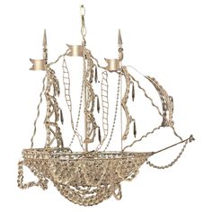 a metal boat with many chains hanging from it's sides and two lights on each side