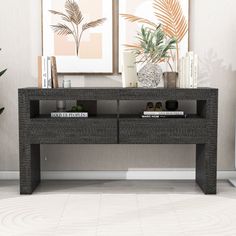 a modern console table with two open compartments on each side and bookshelf below