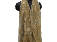 Pattern -lace scarf. Ideal for -  women. Occasion -   formal or casual. Fabric - soft fine net embroidered fabric.Has a cutwork design on the edges. Color - golden with a very elegant shine. Can be wrapped in different styles. The scarf is a self embroidered floral design in golden color. Size - 36 x 96 inches(approx). Care - gentle hand wash. Festive Gold Shawl Scarf, Luxury Gold Elegant Scarves, Elegant Beige Embroidered Scarves, Luxury Gold Scarves, Golden Scarf, Trendy Scarf, Scarf Gift Ideas, Scarf Lace, Trendy Scarves