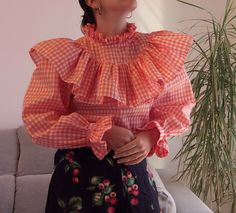 "Handmade orange gingham ruffles top. Oversize frills ruffles long sleeve shirt blouse. Size S. Measurements lying flat> Bust: 18\"/46cm Length: 22\" / 56cm Sleeve length: 22,8\" 58cm" Spring Long Sleeve Plaid Top, Plaid Long Sleeve Top For Spring, Gingham Puff Sleeve Top For Fall, Trendy Orange Cotton Blouse, Cotton Blouse With Ruffles And Lantern Sleeves, Plaid Long Sleeve Blouse With Ruffles, Cotton Ruffled Lantern Sleeve Blouse, Trendy Ruffled Lantern Sleeve Tops, Long Sleeve Ruffled Blouse With Relaxed Fit