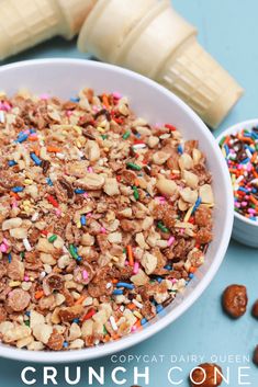 a white bowl filled with cereal and sprinkles