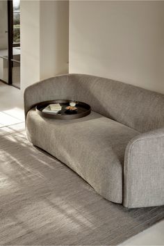 Create a harmonious and inviting atmosphere in your living space with the Curved Back 3-Seater Sofa by Ethnicraft. This exquisite Ellipse sofa features a natural fabric exclusively woven for Ethnicraft in Belgium. Its stain-repellent coating ensures resilience against small accidents, making it practical for everyday use. Choose from the sophisticated "oatmeal" or "ash" colors, seamlessly blending into urban apartments or country houses. For a perfect finishing touch, complement the sofa with ou Urban Apartment, Natural Fabric, Stain Resistant Fabric, Burke Decor, Simple Colors, Bedroom Bed, 3 Seater Sofa, Wabi Sabi, Seater Sofa