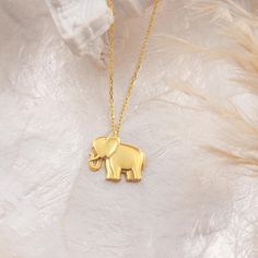 Embrace the charm and significance of our Elephant Necklace, a stunning piece that symbolizes strength, wisdom, and good luck. This beautifully crafted necklace is perfect for animal lovers and anyone who appreciates unique and meaningful jewelry. Key Features:13.69mm x 17.22mm  Material: Made from 14K Real Solid Gold. Meaningful Design: The elephant is a powerful symbol of strength and loyalty, making this necklace a beautiful reminder of the values you hold dear. It also represents good fortun Surprise Gifts For Her, Gold Butterfly Necklace, Necklace Model, Butterfly Necklace Gold, Elephant Jewelry, Lucky Elephant, Gold Elephant, Chakra Pendant, Elephant Necklace