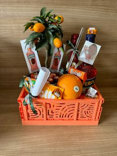 an orange basket filled with lots of food