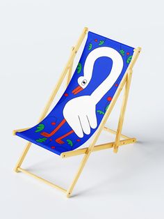 a blue and white beach chair with a cartoon swan on it's back legs