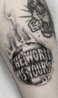 a man's arm with a tattoo on it that says he world is yours