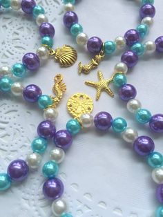 the necklaces are decorated with pearls and charms