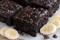 some brownies and bananas on a white plate