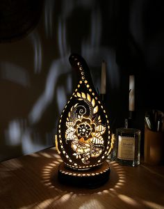 a decorative lamp sitting on top of a wooden table