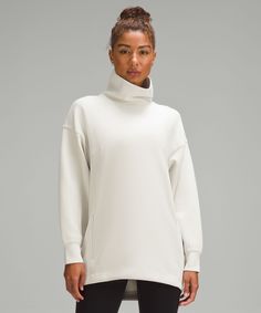 Cozy, Cool Coverage Is The Name Of The Game In This Cocoon-Shaped Turtleneck. In A Smooth Fabric That Feels Cool To The Touch, Its A Layer You Wont Want To Take Off. Designed For On The Move. A Loose Fit With A Little Extra Room:long Length Keeps Bum And Hips Covered. Kangaroo Pocket With Hidden Phone Sleeve. High Neck For Added Coverage. | Modal-Blend Turtleneck Tunic Silk Tunic Top, Turtleneck Tunic, Tunic Designs, Women's Hoodies, Womens Turtleneck, Extra Room, Women Hoodies Sweatshirts, Lululemon Women, Tunic Sweater