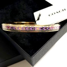 New Coach Women's Bangle Bracelet Plated Color Pink And Gold Coach Metal Bangle Jewelry, Formal Pink Bangle Bracelet, Pink Bangle Bracelet For Formal Occasions, Pink Metal Bangle Bracelet, Pink Adjustable Cuff Bracelet, Coach Gold Bangle Bracelet, Coach Silver Bangle Bracelets, Coach Silver Bangle Bracelet, Adjustable Pink Cuff Bracelet