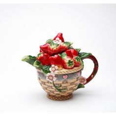 a basket filled with strawberries on top of a table