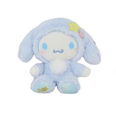 a blue stuffed animal sitting on top of a white surface