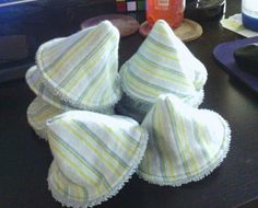 four towels folded on top of each other sitting on a desk next to a computer