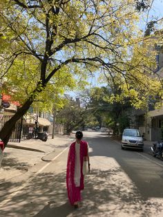 a man walking down the middle of a street