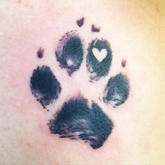 an animal paw print with hearts on it