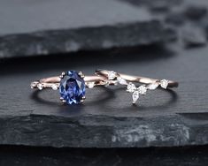 two different types of engagement rings with blue and white stones on top of each other