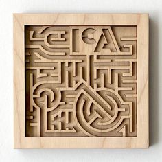 an intricate carved wooden plaque with the words