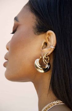 A chunky crescent design brings a contemporary twist to this pair of bold hoops plated in polished 18-karat gold. 1 1/4" hoop diameter 18k-gold plate Imported 90s Jewelry, Triple Hoop Earrings, Boho Hoop Earrings, Golden Hoops, Hoop Earrings Style, Keep Jewelry, Quality Jewelry, Ear Piercings, Fashion Earrings