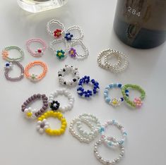 several bracelets and a bottle on a table