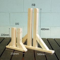 a wooden stand with measurements for the legs