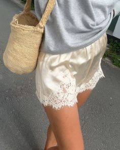 Laura Vidrequin Roso on Instagram: "Some will call it silky shorts paired with a grey sweatshirt, but I see it  as 2 jours de rab avant la rentrée. I also sat on that chair for a bit too long" Laura Vidrequin, Satin Shorts Outfit, Silk Shorts Outfit, Long Shorts Outfits, Vintage Lace Top, White Linen Skirt, Sequin Tank Top, Sheer Knit, Black Silk Dress