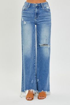 Experience the height of style with our Risen Lainey High Rise Wide Leg Jeans, featuring a medium wash and frayed hems for a touch of artistic rebellion. Elevate your look with these luxurious and timeless denim trousers. Materials: 73% COTTON, 25% POLYESTER, 2% SPANDEX Exchanges We have a 7-day exchange policy, which means you have 7 days after receiving your item to request an exchange. We only do exchanges or instore credit. We do not offer refunds!To be eligible for an exchange, your item mu Fitted Crop Top, Fashion Forward Outfits, Jean Large, Edgy Look, Wide Leg Jeans, Short Tops, Leg Jeans, Outfit Sets, Jumpsuit Dress