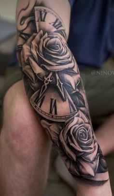 a man with a clock and roses tattoo on his arm