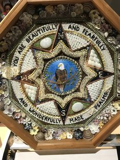 an intricately decorated clock with words on it