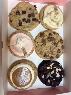 a box filled with assorted cookies and desserts