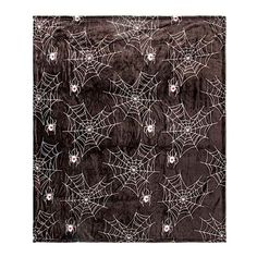 a black and white scarf with spider webs on it