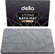 the stone bath mat is next to an extra large box